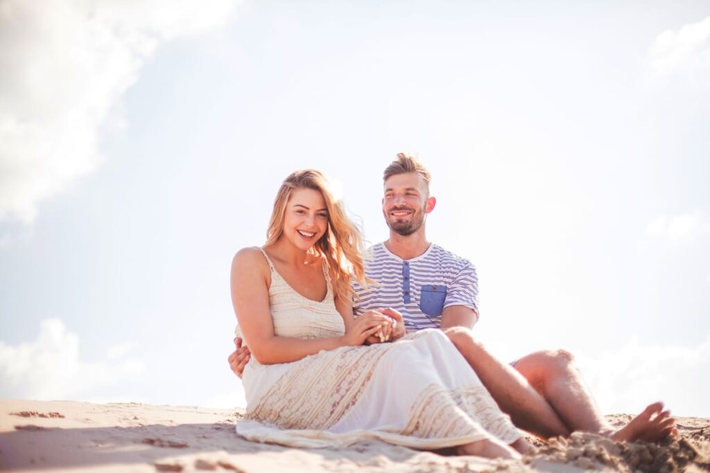 Happy couple in the sand